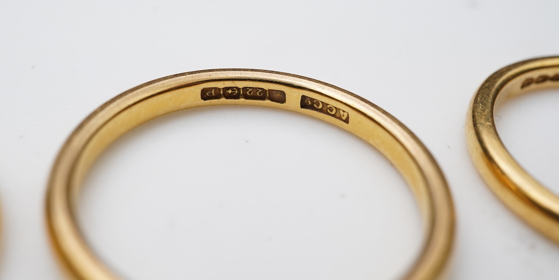 A collection of four gold rings